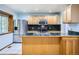 Spacious kitchen with stainless steel appliances, island sink and bright recessed lighting at 2603 W 100Th Pl, Denver, CO 80260