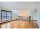 Open living room with hardwood floors and ample natural light, ideal for entertaining at 2603 W 100Th Pl, Denver, CO 80260