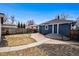 View of detached garage and fenced backyard offering privacy and security at 5094 Meade St, Denver, CO 80221