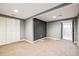 Finished basement area featuring carpet, a large closet, and an adjacent room at 5094 Meade St, Denver, CO 80221