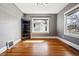 Bedroom features hardwood floors, classic trim and large windows providing natural light at 5094 Meade St, Denver, CO 80221