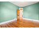 Bedroom with hardwood floors and decorative glass doorway at 5094 Meade St, Denver, CO 80221