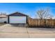 View of detached garage and fenced backyard offering privacy and security at 5094 Meade St, Denver, CO 80221