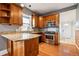 Well-lit kitchen featuring granite countertops, stainless steel oven, and wood cabinetry at 5094 Meade St, Denver, CO 80221