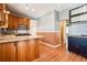 Well-lit kitchen featuring wood cabinets, granite countertops and tile backsplash at 5094 Meade St, Denver, CO 80221