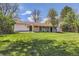 Lush backyard features a spacious lawn and covered patio, perfect for outdoor living at 130 S Eaton St, Lakewood, CO 80226