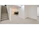 A finished basement with carpet and stairs leading up to the main floor at 130 S Eaton St, Lakewood, CO 80226