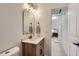 Bathroom with modern vanity and a view into the bedroom at 130 S Eaton St, Lakewood, CO 80226