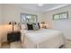 Cozy bedroom featuring a comfortable bed, stylish decor, and ample natural light from the windows, creating a restful retreat at 130 S Eaton St, Lakewood, CO 80226