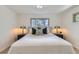Inviting bedroom with a comfortable bed, modern decor, and ample natural light from the windows, perfect for relaxation at 130 S Eaton St, Lakewood, CO 80226