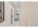 Bright hallway with marble floors leads into a bedroom with a decorative bed at 130 S Eaton St, Lakewood, CO 80226