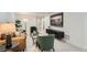 A stylish finished basement with a leather sofa and velvet chairs at 130 S Eaton St, Lakewood, CO 80226