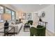 Well-lit living room with modern furnishings, neutral tones, and bright natural light, creating an inviting atmosphere at 130 S Eaton St, Lakewood, CO 80226