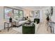 Bright living room featuring modern furniture, stylish decor, and large windows offering plenty of natural light and a comfortable ambiance at 130 S Eaton St, Lakewood, CO 80226