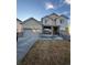 Charming two-story home with a two car garage, stone accents, and neutral colors at 14241 Ivanhoe St, Thornton, CO 80602