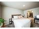 Spacious main bedroom with large bed, walk-in closet, and neutral color scheme at 1563 Bellflower Dr, Brighton, CO 80601