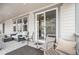 Back porch with comfortable seating and multiple windows providing ample natural light at 2598 Knobbie Cir, Castle Rock, CO 80109