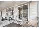 Large, covered back porch has seating with outdoor furniture, perfect for relaxing outdoors at 2598 Knobbie Cir, Castle Rock, CO 80109