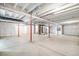 Unfinished basement with cement floors and white wrapped walls provides a blank canvas for customization at 2598 Knobbie Cir, Castle Rock, CO 80109