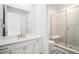 Modern bathroom featuring a glass shower, double vanity and contemporary fixtures at 2598 Knobbie Cir, Castle Rock, CO 80109