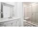 Bright bathroom features a glass enclosed shower, and a dual sink vanity with modern finishes at 2598 Knobbie Cir, Castle Rock, CO 80109