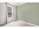 Cozy bedroom features an oversized window, neutral decor, and ample natural light at 2598 Knobbie Cir, Castle Rock, CO 80109