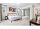 Bright bedroom featuring a walkout balcony, neutral decor, and abundant natural light at 2598 Knobbie Cir, Castle Rock, CO 80109