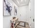 Bright entryway with hardwood floors, modern decor, and a white door at 2598 Knobbie Cir, Castle Rock, CO 80109