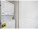 Convenient laundry area features a stacked washer and dryer for space-saving efficiency at 2598 Knobbie Cir, Castle Rock, CO 80109