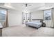 Large main bedroom with tray ceiling, ceiling fan and many windows providing natural light at 2598 Knobbie Cir, Castle Rock, CO 80109