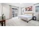 Relaxing main bedroom featuring a queen bed, plush carpet, and access to a private balcony at 2598 Knobbie Cir, Castle Rock, CO 80109