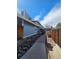 View of the home's walkway and exterior, with stone landscaping and privacy fencing at 264 S Newark Cir, Aurora, CO 80012