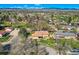 Overhead view of a charming neighborhood with a park nearby, showcasing mountain views in the distance at 3906 Hoyt Ct, Wheat Ridge, CO 80033