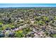 Expansive aerial view of a residential neighborhood with lush green trees and well-maintained homes at 3906 Hoyt Ct, Wheat Ridge, CO 80033