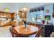 Kitchen with a breakfast nook featuring a wood table and an adjacent window at 3906 Hoyt Ct, Wheat Ridge, CO 80033