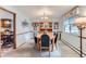 Cozy dining room with a built-in china cabinet, adjacent to the kitchen and living room at 3906 Hoyt Ct, Wheat Ridge, CO 80033