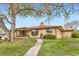 Well-maintained ranch home with a landscaped front yard and mature shade trees at 3906 Hoyt Ct, Wheat Ridge, CO 80033