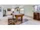 Recreation room with a pool table and natural light, perfect for entertaining guests at 3906 Hoyt Ct, Wheat Ridge, CO 80033
