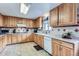Traditional kitchen featuring light wood cabinets, white countertops and tile flooring at 3906 Hoyt Ct, Wheat Ridge, CO 80033