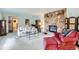 Cozy living room with a stone fireplace and ample seating, perfect for gatherings at 3906 Hoyt Ct, Wheat Ridge, CO 80033