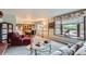 Bright and inviting living room with large window, adjacent to the dining area at 3906 Hoyt Ct, Wheat Ridge, CO 80033