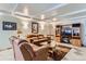 Inviting living room featuring comfortable leather seating and a large entertainment center at 3906 Hoyt Ct, Wheat Ridge, CO 80033