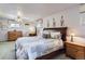 Comfortable bedroom featuring soft lighting, wood furniture, and a cozy bed at 3906 Hoyt Ct, Wheat Ridge, CO 80033