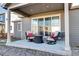Relaxing back patio with comfortable seating, perfect for outdoor dining and entertaining at 802 Eva Peak Dr, Erie, CO 80516
