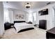 Spacious bedroom with cozy carpet, TV and dresser furniture; brightened by curtains and artwork at 802 Eva Peak Dr, Erie, CO 80516