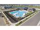 Community pool and lounge area with pool, seating, and a well maintained landscape at 802 Eva Peak Dr, Erie, CO 80516