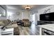 Cozy living room with comfortable seating, stylish decor, and seamless access to outdoor patio area at 802 Eva Peak Dr, Erie, CO 80516