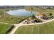 Community pond with walking path, benches, and a covered pavilion, offering a relaxing retreat at 802 Eva Peak Dr, Erie, CO 80516