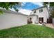 A well-maintained backyard with green grass and patio seating; great for relaxing outdoors at 1385 Birch St, Denver, CO 80220