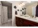 Bathroom with double vanity and a shower with modern fixtures at 1385 Birch St, Denver, CO 80220